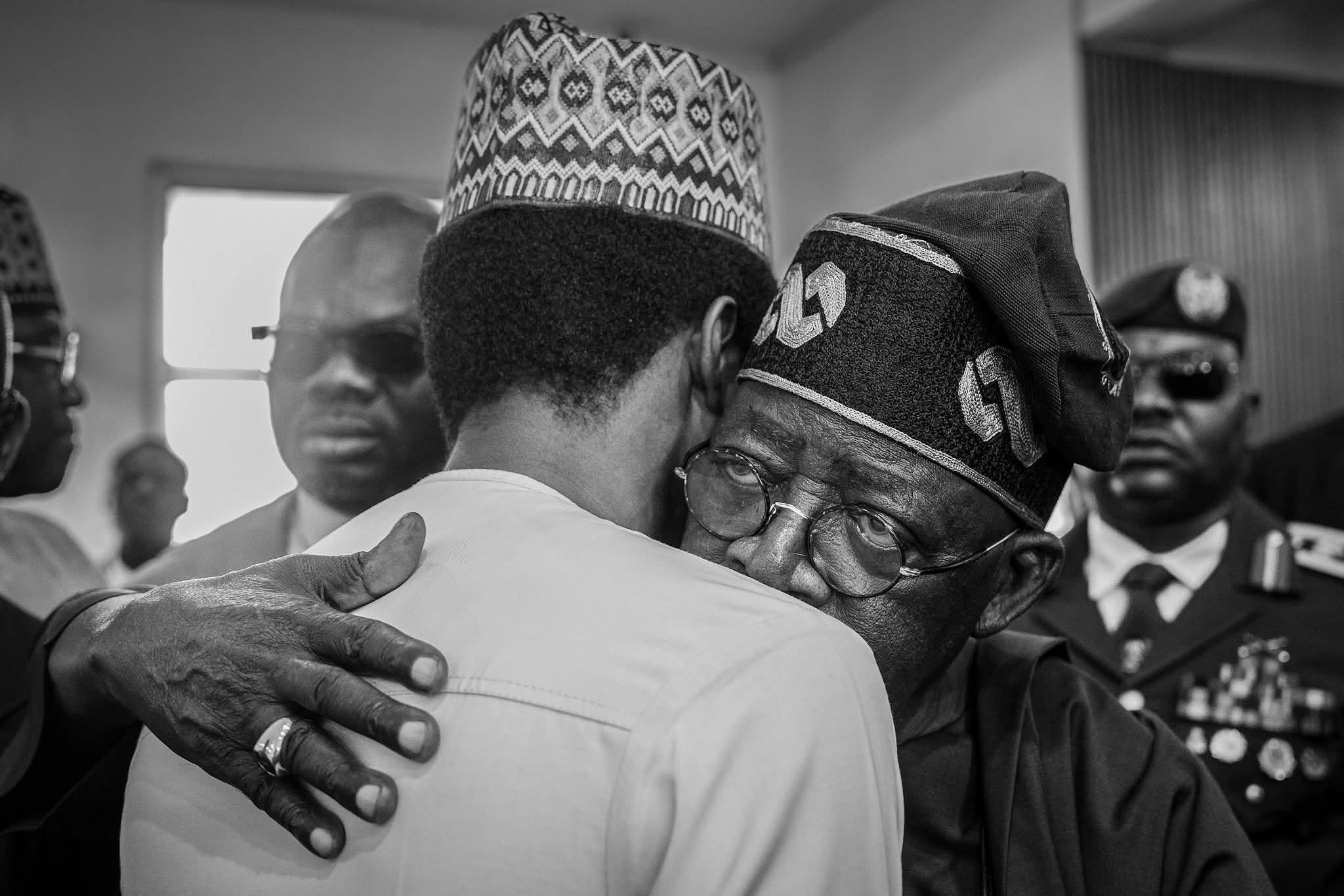 President Bola Tinubu consoling Yusuf Buhari at the burial